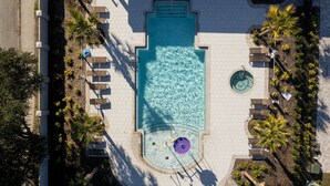 An aerial view of a swimming pool surrounded by palm trees and lounge chairs. - Disney! Private Pool, Hot Tub & Themed Bedrooms. Book Now! #VDR14 (Orlando)