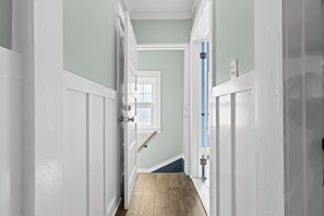 Bathed in natural light, this hallway exudes a sense of openness and brightness, making the transition through your home a truly pleasant and rejuvenating experience. - New! Cozy 2BR near Lake at Anchor Bay (New Baltimore,)