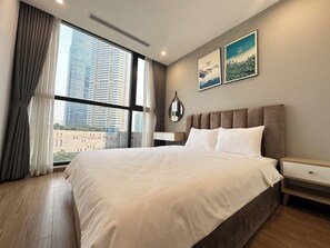 Standard Apartment, 1 Bedroom, City View | Premium bedding, down comforters, pillowtop beds, desk - LT.Housing Vinhomes Skylake (Hanoi)