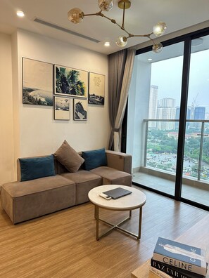 Standard Apartment, 1 Bedroom, City View | Living area | 55-inch Smart TV with digital channels, pay movies - LT.Housing Vinhomes Skylake (Hanoi)