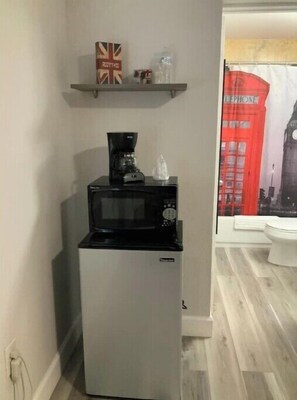 Enjoy cooking and dining in this well-equipped kitchenette with a microwave oven and refrigerator.