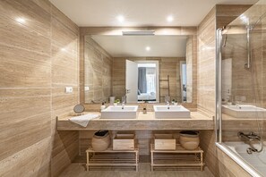 Shower, hair dryer, towels, toilet paper