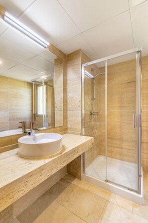 Shower, hair dryer, towels, toilet paper