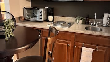 Fridge, microwave, stovetop, coffee/tea maker