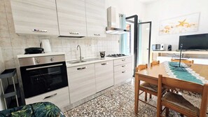 Fridge, microwave, oven, stovetop - Holiday Home “Casa Lamarmora” with Large Terrace, Air Conditioning & WiFi (Nebida)