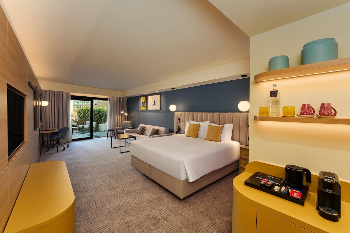 Grand Terrace Suite | Minibar, in-room safe, desk, laptop workspace
