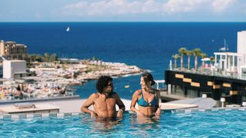 Indoor pool, outdoor pool, pool umbrellas, pool loungers