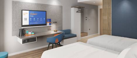 Una habitación de hotel moderna con televisión de pantalla plana, un escritorio con silla, un sofá y una cama.
