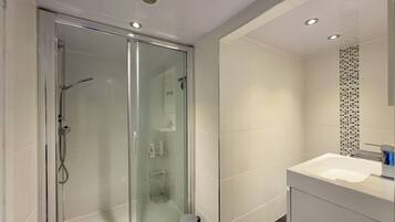 Shower, hair dryer, towels, soap
