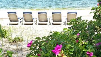 On the beach, sun loungers, beach towels