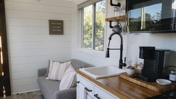 Fridge, microwave, stovetop, coffee/tea maker