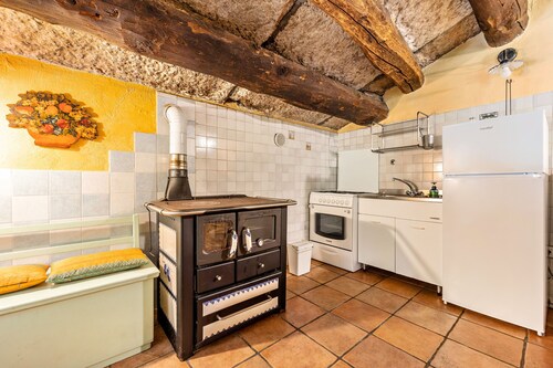 Apartamento 'Appartamento Del Vecchio Fienile' con vistas a las montañas y jardín compartido