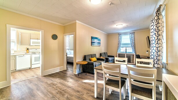 A compact living space with a kitchen, dining area, and seating area.