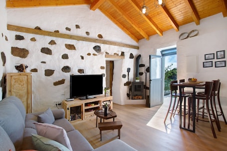 TV, fireplace. 'Casa Tito Y Teresita' with Sea View, Private Terrace and Wi-Fi