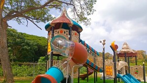 A playground with slides and climbing structures. -  Open concept space waiting to be discovered. 
Modern accessible & affordable.  (Buccoo)