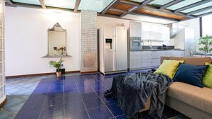 A modern kitchen with a built-in oven, a refrigerator, and a sink. - Milano, Industrial Loft (Milano)