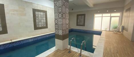 Indoor pool, seasonal outdoor pool, pool umbrellas, pool loungers