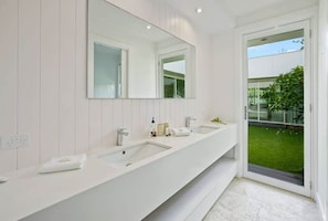 Shower, hair dryer, towels, shampoo
