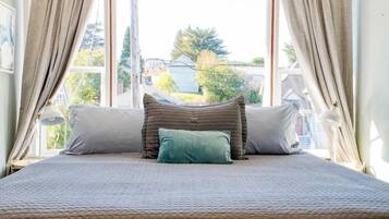 1 bedroom, desk, iron/ironing board, travel crib