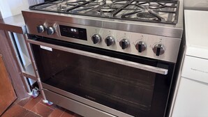 A stainless steel kitchen with a built-in oven and a gas stove. - Gum Valley Quarters: perfect for large groups and families (Western River)