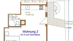 Grundriss eines Gebäudes mit zwei Wohnungen, jede mit Badezimmer, Küche und Wohnbereich. Wohnung 2 hat 44,72 m² Wohnfläche und einen Balkon.