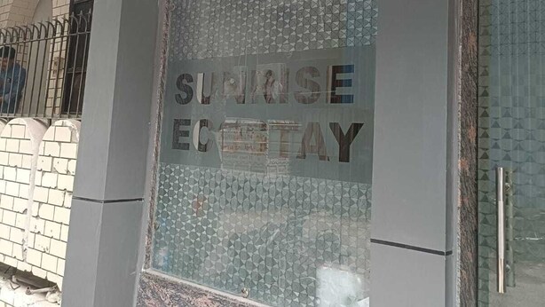 A building facade with the words "Sunrise Ecotay" prominently displayed. - Hotel Sunrise Ecostay  (New Delhi)
