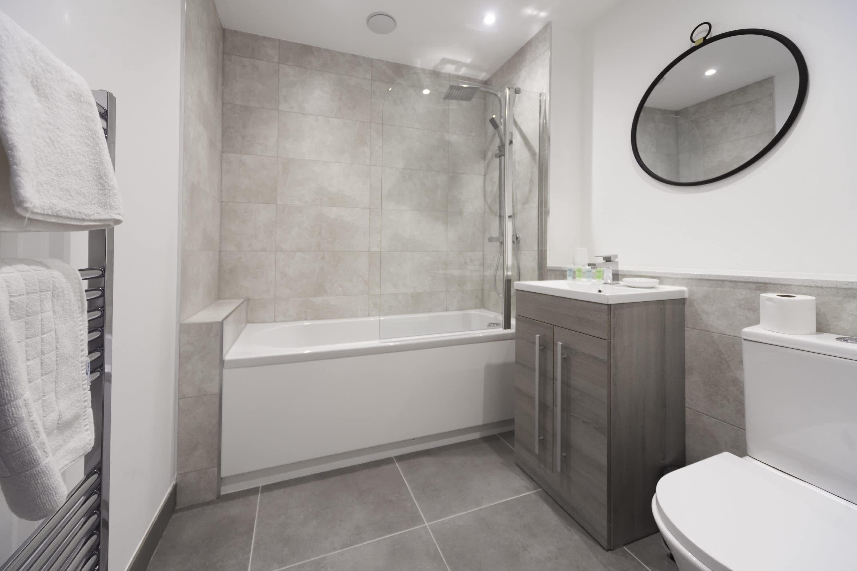 Shower, hair dryer, towels, shampoo