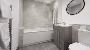 Shower, hair dryer, towels, shampoo
