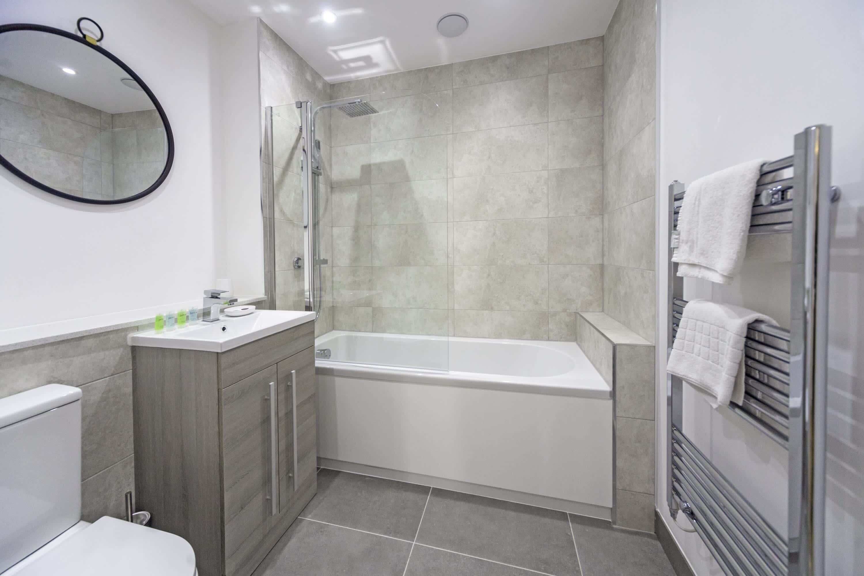 Shower, hair dryer, towels, shampoo