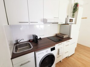 Fridge, microwave, stovetop, coffee/tea maker
