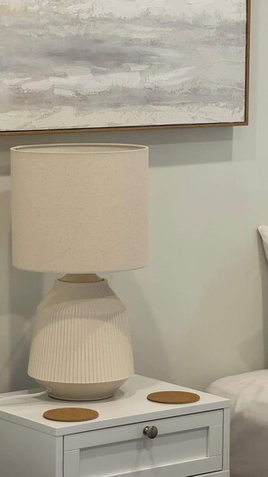 A white bedside table with a lamp, a drawer, and a cork coaster. - Farm Stay, Picturesque views (Balhannah)