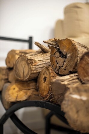 A stack of logs on a metal rack. - Farm Stay, Picturesque views (Balhannah)