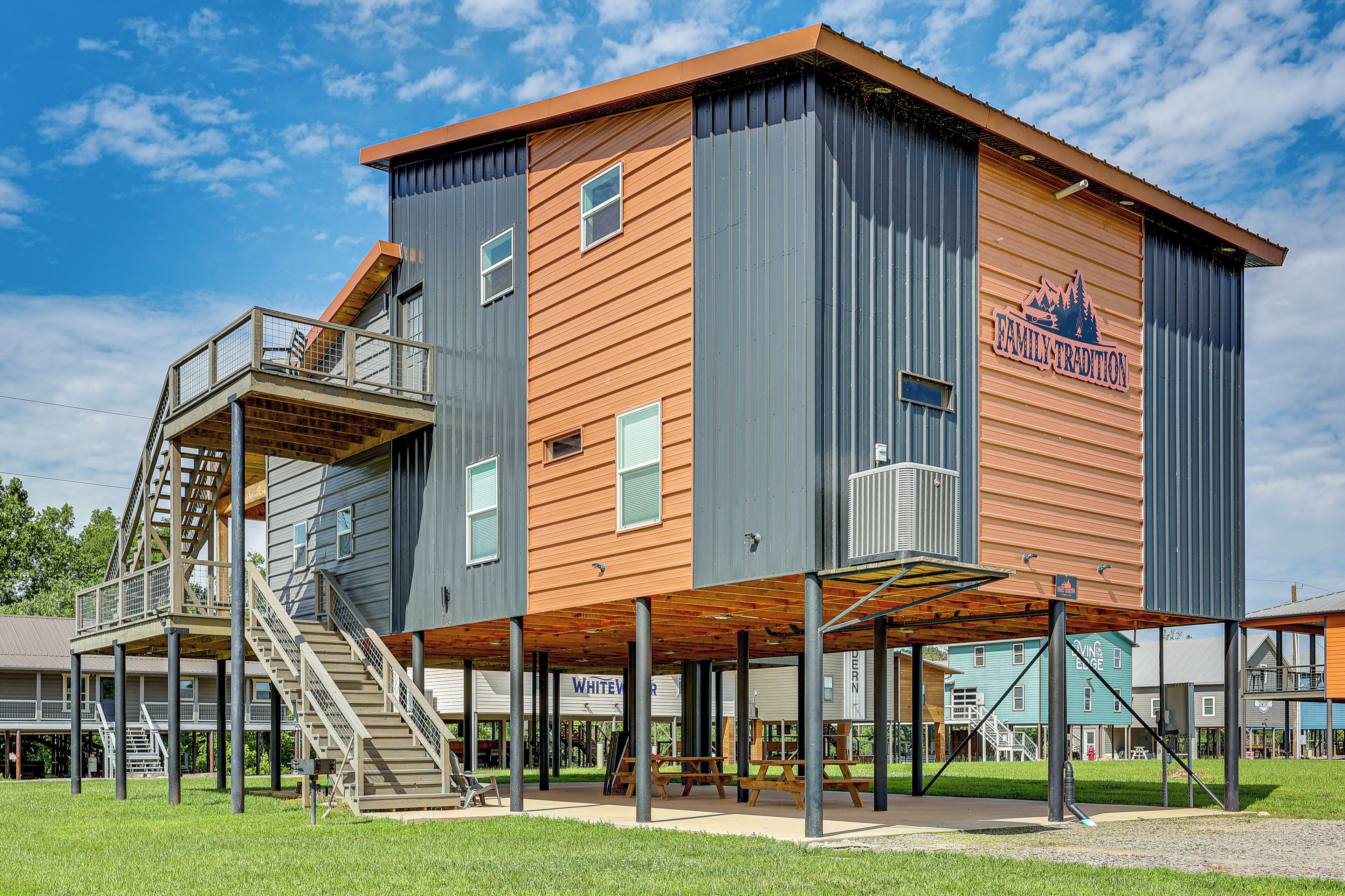 A multi-story building with a wooden facade and a balcony.