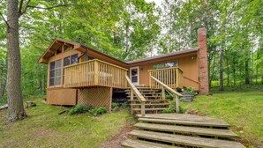 A wooden cabin with a deck and stairs leading to the entrance. - Sullivan Lake Cabin w/ Pierz & Hillman Access! (Hillman)