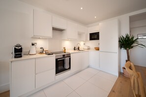 Fridge, microwave, oven, stovetop - Lundy View, a two bedroom seaside holiday apartment in Lynmouth (Lynmouth,)