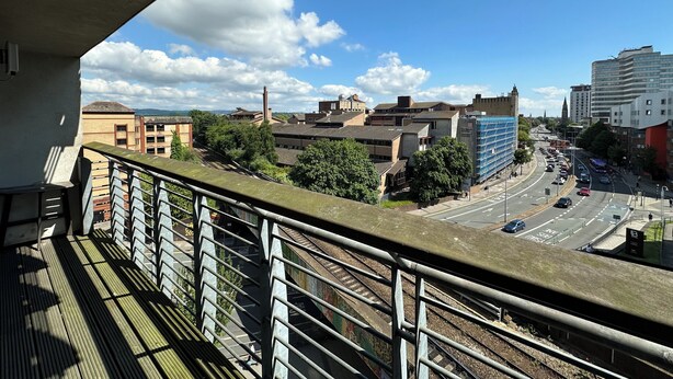 A cityscape with buildings, a clear sky, and a railway track. - The Cardiff Apartment (Cardiff)