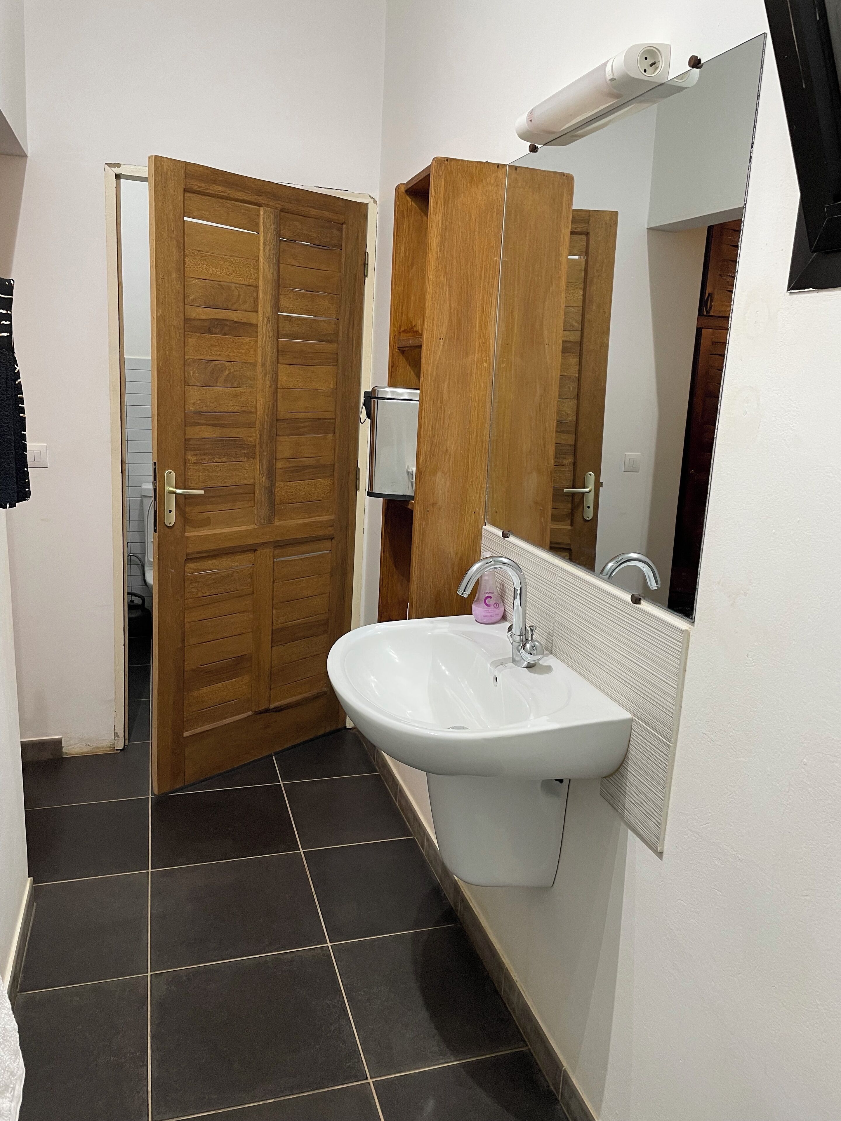Shower, hair dryer, towels, toilet paper