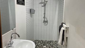 Shower, hair dryer, towels, toilet paper