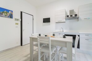 Apartment, Balcony | Living area | 35-inch TV with digital channels