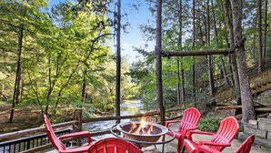 Terrace/patio - Riverside Luxury: Hot Tub, Fire Pit & Fishing Dock! Game Room, Fireplace! (Ellijay)
