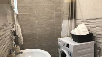 Shower, hair dryer, bidet, towels