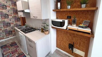 Microwave, stovetop, coffee/tea maker, cookware/dishes/utensils
