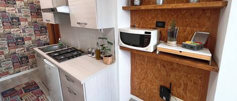 Microwave, stovetop, coffee/tea maker, cookware/dishes/utensils