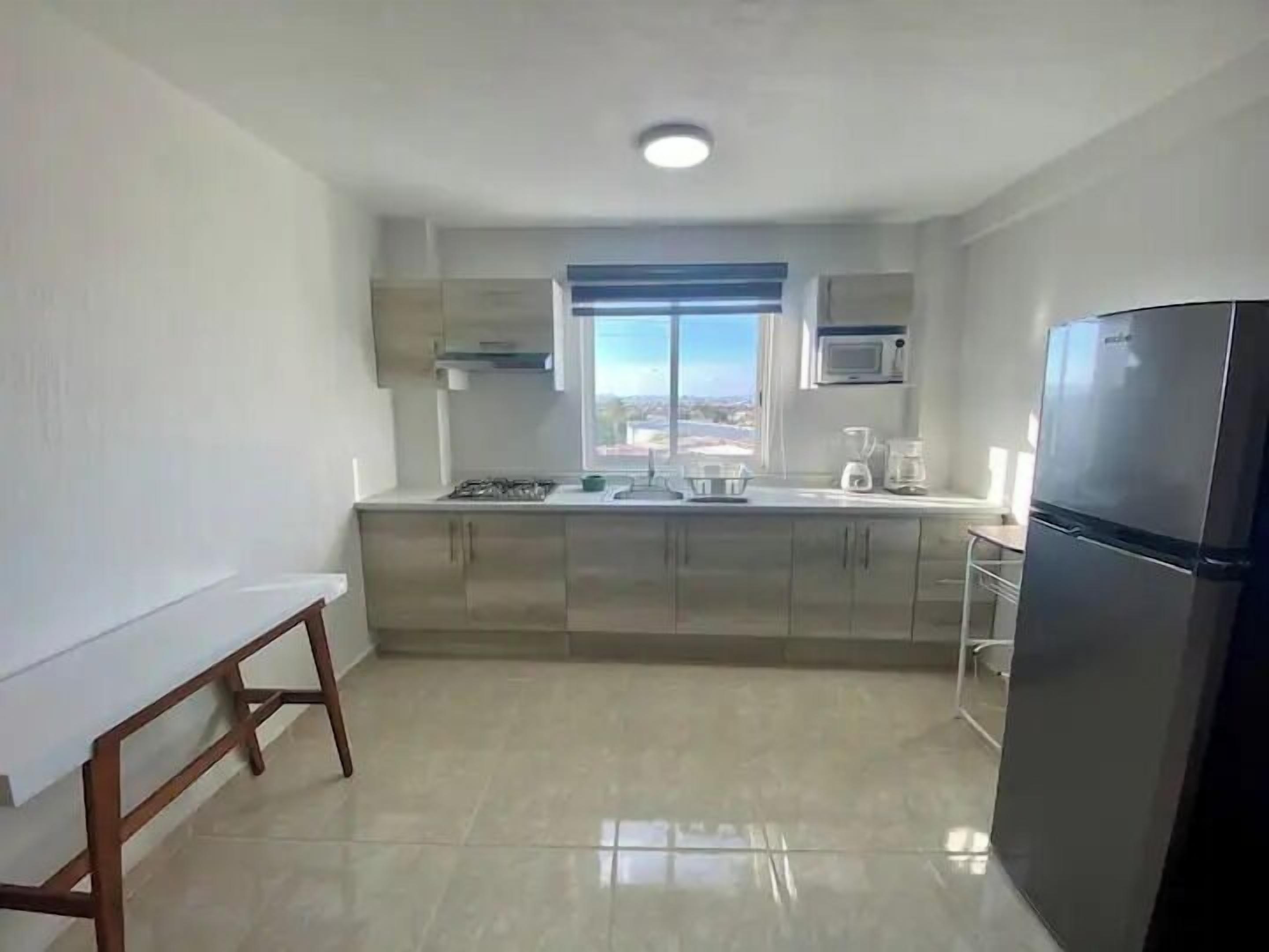 Apartment, Multiple Beds, Kitchen, Tower | Private kitchen | Fridge, microwave, oven, dishwasher
