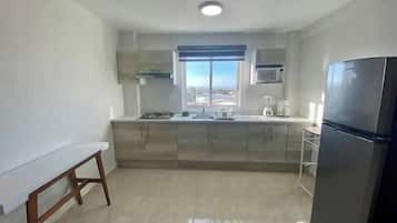 Apartment, Multiple Beds, Kitchen, Tower | Private kitchen | Fridge, microwave, oven, dishwasher