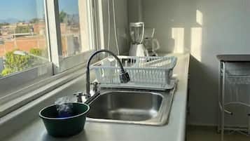 Departamento, varias camas, cocina, torre | Cocina privada | Refrigerador, microondas, horno y lavavajillas