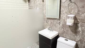 Shower, rainfall showerhead, towels, soap