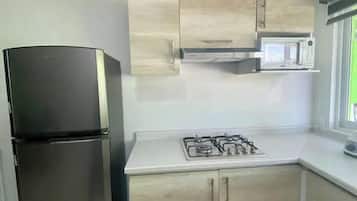 Appartamento, letti multipli, cucina, piano elevato | Cucina privata | Frigorifero, microonde, forno, lavastoviglie