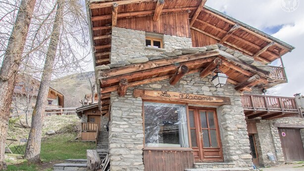 A rustic mountain lodge with stone walls and wooden balconies. - LES FLOCONS - BONNEVAL SUR ARC (BONNEVAL SUR ARC)