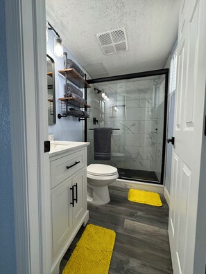 Shower, hair dryer, towels, soap
